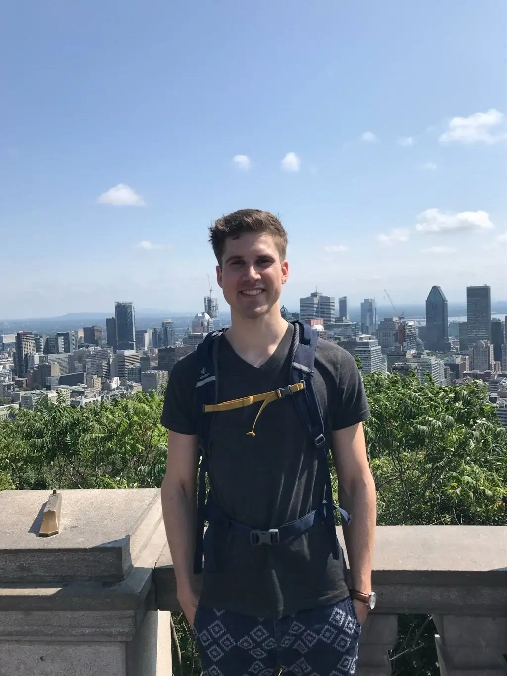 German traveler enjoying the Montreal skyline before embarking on a curated French Caribbean journey with Soley Karayib Travel